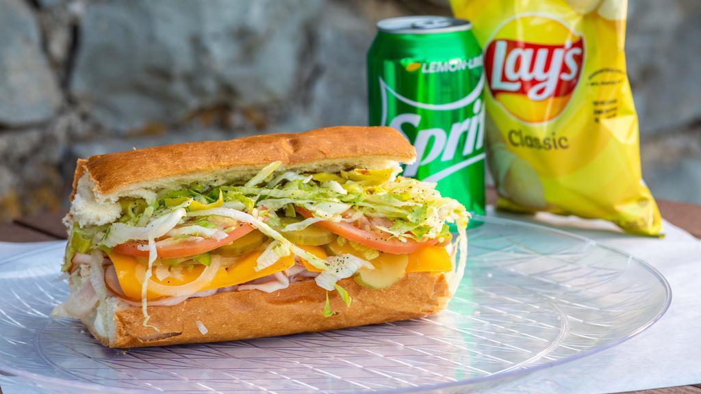 Ham Sub · Served with Swiss on a Bordenave’s roll with lettuce, tomatoes, onions, pickles, peppers, pepperoncini, mayo and mama's secret sauce.