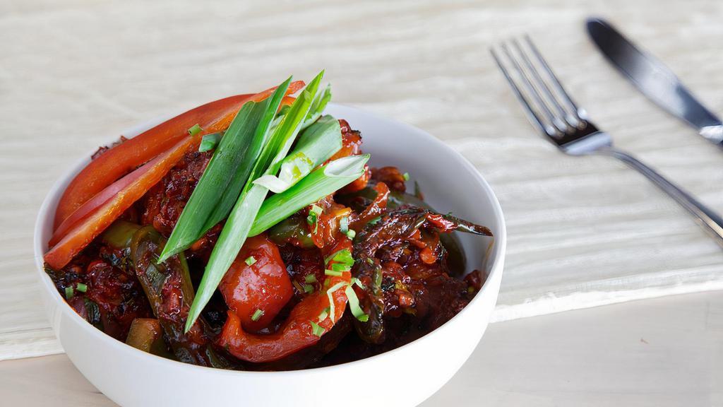 Chilli Chicken · Tossing fried boneless chicken in sweet-sour and spicy chili sauce, garnished with fresh coriander.