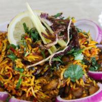 Chicken Biryani · Rice dishes with a bouquet of Indian spices, Chicken, nuts, and raisins, prepared and spiced...