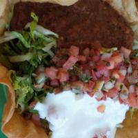 Taco Salad · A flour tortilla bowl Spanish rice, beans, lettuce,
tomatoes, salsa and crema fresca. Grille...
