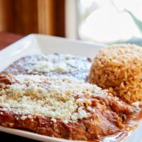 Rellenos · Two giant chile rellenos. Choose between crema fresca or red salsa. Spanish rice and beans.
