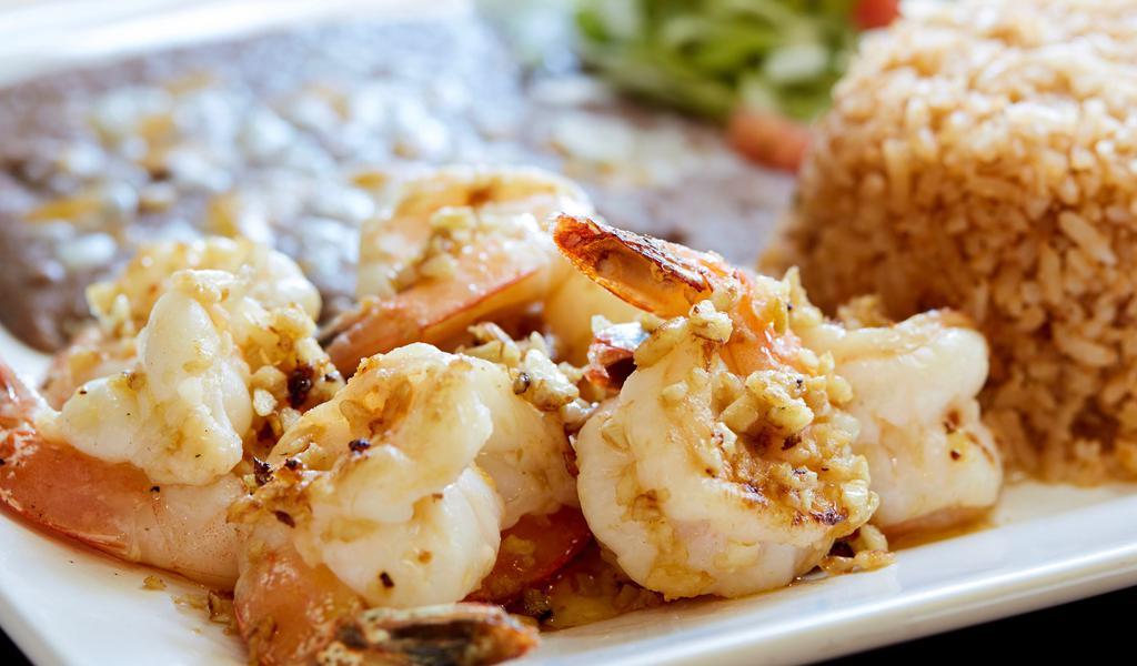 Camarones · Large sautéed prawns in the authentic Mexican style: diabla, chipotle, ranchero, mojo de ajo salsa. Spanish rice, beans, and tortillas.