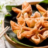 Crab Rangoon · Fried dumplings stuffed with crab meat, cream cheese, green onions, and celery, served with ...