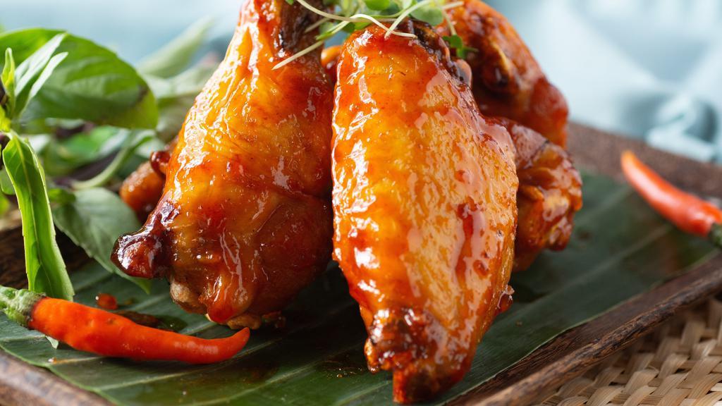 Hot Wings · *Spicy. Deep-fried chicken wings sautéed with chili-garlic sauce.