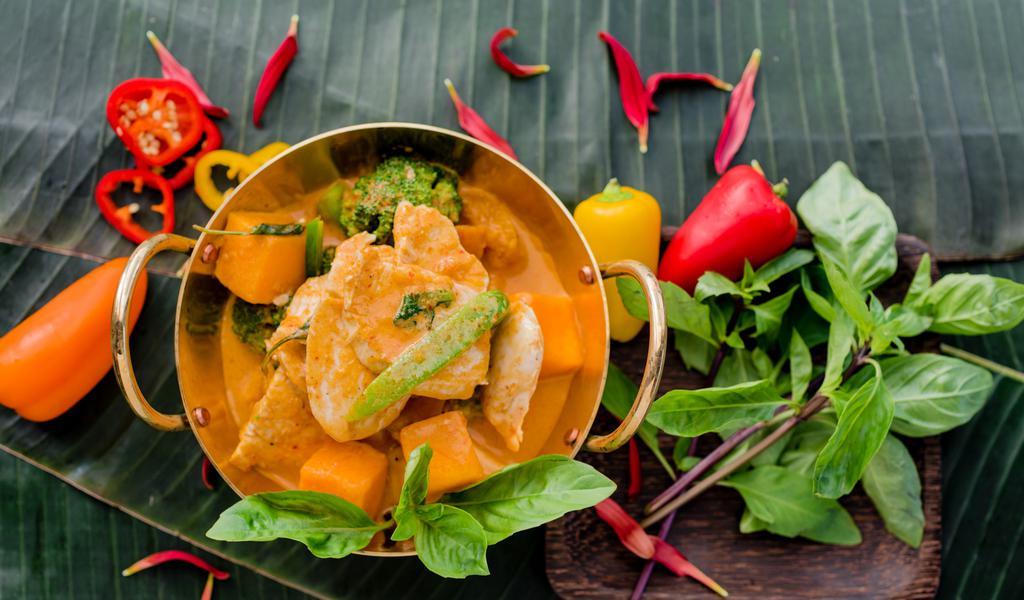 Red Curry · *Spicy. Red coconut milk curry with butternut squash, broccoli, bell peppers, and basil.