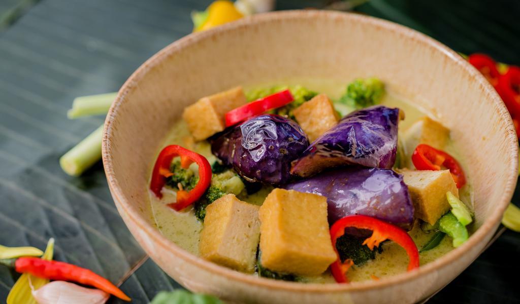 Green Curry · *Spicy. Green coconut milk curry with eggplant, broccoli, bell peppers, and basil.