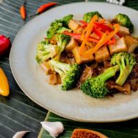 Pad See Ew · Wide rice noodles in sweet soy sauce with egg, broccoli, and garlic.