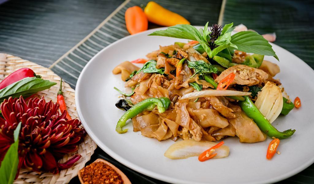 Pad Kee Mao · *Spicy. Wide rice noodles, egg, basil, bell peppers, onions, garlic, and chili.