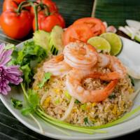 Pineapple Fried Rice · Fried rice with pineapple, egg, raisins, cashew nuts, bell peppers, onions, green onions, an...