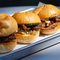 Pastrami Sliders · hot pastrami, caramelized onion, quick pickle, house aioli, three acme baby, pain de mie rolls