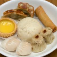 Dim Sum Platter · Spring roll, two potstickers, two shrimp dumplings, two siu myes, steamed pork bun, and a cu...