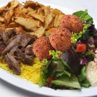 Combo Plate · The combination plate comes with Beef shawarma, chicken shawarma and falafels all on top of ...