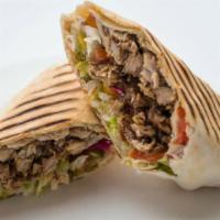 Beef Shawarma Wrap · The beef shawarma wrap includes beef shawarma with grilled onions, tomato, cucumber, hummus,...