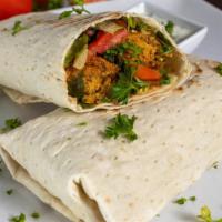 Falafel Wrap · this wrap includes freshly made warm falafel's with hummus, cucumber, tomato, tahini sauce, ...