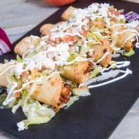 Chalupas De Camaron · 4 Crispy corn tortillas stuffed with shrimp and melted jack cheese, topped with lettuce, pic...