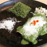 Enchiladas Suizas · Two chicken enchiladas covered with green tomatillo sauce and melted jack cheese served with...