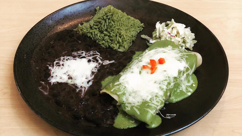 Enchiladas Suizas · Two chicken enchiladas covered with green tomatillo sauce and melted jack cheese served with rice, black beans and topped with sour cream and roasted bell peppers.