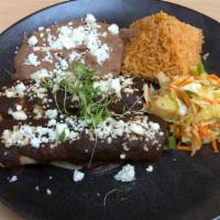 Two Mole Enchiladas · Choice of meat covered with mole sauce and melted cheese.