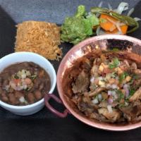 Carnitas · Roasted pork served with whole beans, rice, guacamole and tortillas.