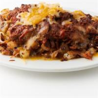 Chili cheese fries · Our home fries topped with cheese and our homemade chuckwagon  chili , sour cream and green ...