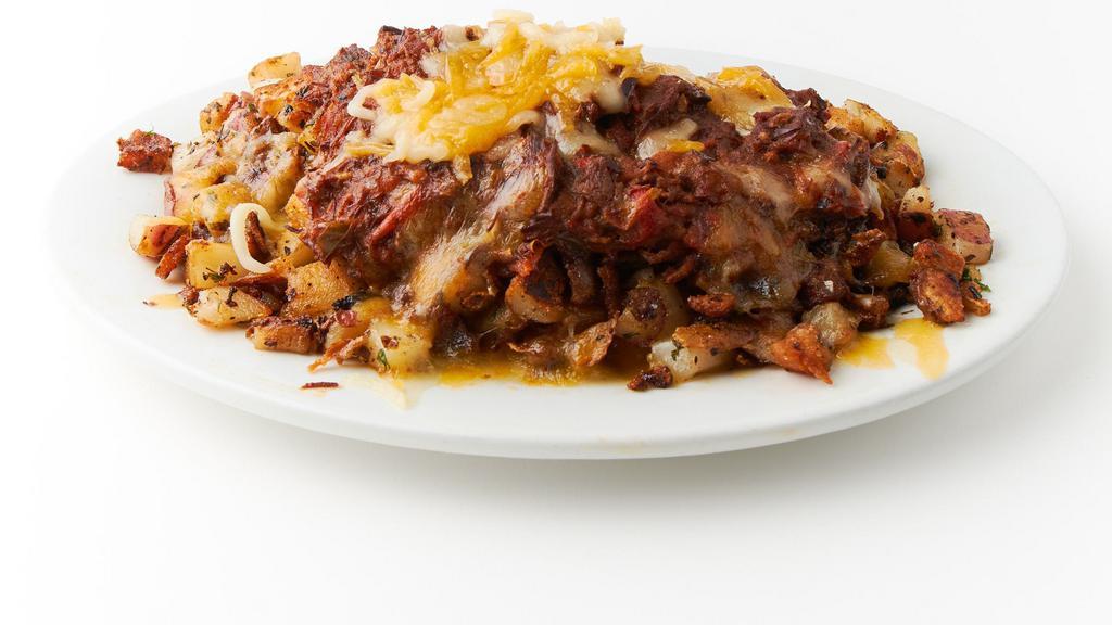 Chili cheese fries · Our home fries topped with cheese and our homemade chuckwagon  chili , sour cream and green onions