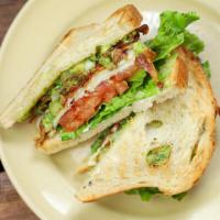 California Club · Roasted turkey breast ,bacon, guacamole, mayo, lettuce and tomato  on toasted sourdough with...
