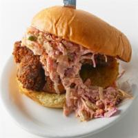 Fried Chicken · Buttermilk brined fried chicken thighs, coleslaw, pickles and our corrupted sauce served on ...