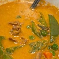 55. Panang Curry · Spicy. Panang sauce with coconut milk, bell pepper, snow pea, carrot and Thai basil.