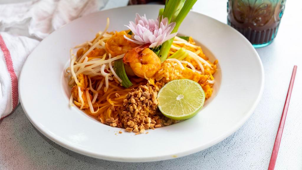 32. Pad Thai · Pan fried Thai noodle with egg, green onion, bean sprout and ground peanut in homemade-pad Thai Sauce.