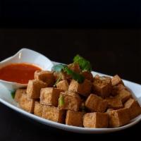 Fried Tofu · Deep fried soft tofu served with a sweet and sour chili sauce.