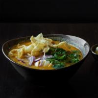 Ohn-No Khao Swe (Coconut Noodle Tofu Soup) · A rich and creamy bisque with flour noodles. Served with sliced tofu, onions, turmeric powde...