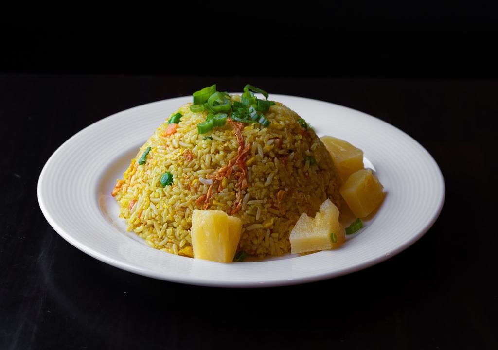 Pineapple Fried Rice · Choice of jasmine or brown rice with pineapple, green beans, carrots, egg, onions, scallions, soy sauce and turmeric (vegan option available).