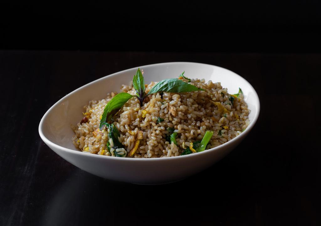 Pine Nut Fried Rice · Brown rice with pine nuts, pea leaves, eggs and garlic (vegan option available).
