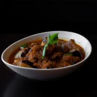 Burmese Eggplant Curry · Burmese style red curry with eggplant, ginger, garlic, paprika, turmeric, tamarind and masala.