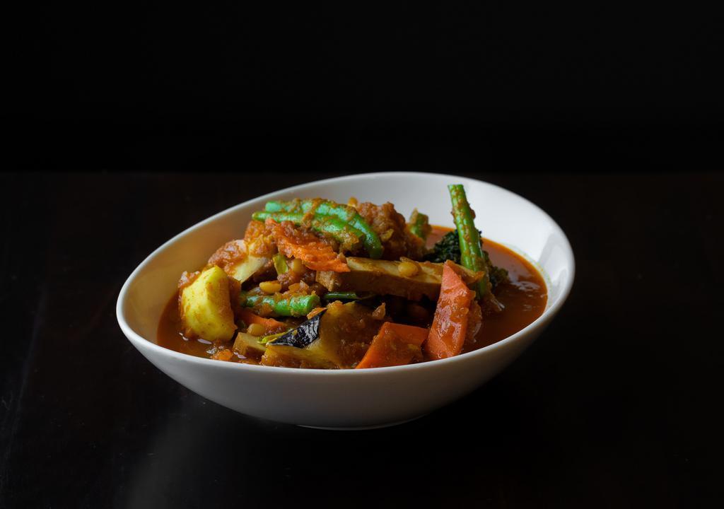Mixed Vegetable Curry · Burmese style red curry with eggplant, tomatoes, string beans, cabbage, broccoli, opo, tofu, ginger, garlic, paprika, turmeric, tamarind and masala.