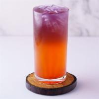 Mango Magenta · Strawberry and mango tea topped with Butterfly Pea tea. Colors are 100% natural. Not recomme...