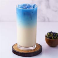 Ocean Potion · Floral oolong tea with fresh milk, topped with blue Butterfly Pea tea. Colors are 100% natur...