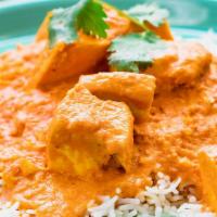 Chicken Tikka Masala · Tender White Chicken in Creamy Tomato Curry on a layer of rice