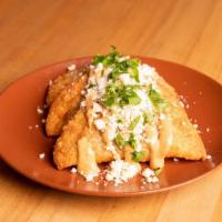 Chicken empanadas · With cheese, chipotle mayo and cilantro