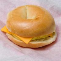 Egg And Cheese Bagel · Two scrambled eggs and cheese on a bagel.