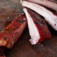 Full Rack Smoked Spare Ribs · 12 ribs. served w/ house pickles, red pickled onions, house BBQ sauce

don't forget to add s...