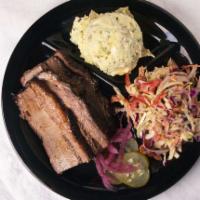 Smoked Beef Brisket Plate · Creekstone Natural 100% Black Angus Beef.
1/2 lb. Smoked low and slow for 12-14hrs. Served S...