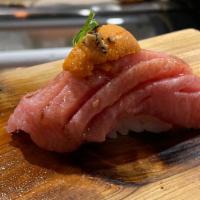 Nigiri O Toro (Fatty Tuna) · two pieces fish over rice