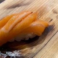 Nigiri Sake (Salmon) · Two pieces of salmon over rice.