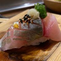 Nigiri Shima Aji · Japanese Striped Jack,Two pieces fish over rice.