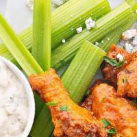 Valencia Wings · 7-8 pieces. Fried wings tossed with honey buffalo sauce, served with ranch for dipping.