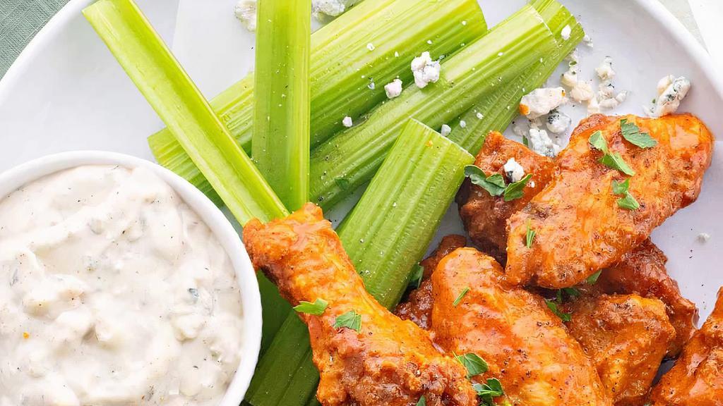 Valencia Wings · 7-8 pieces. Fried wings tossed with honey buffalo sauce, served with ranch for dipping.