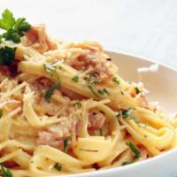 Fettuccine Carbonara Pasta · Crispy bacon, mushroom, garlic, cream, and parmesan cheese sauce. Served with steamed veggie...