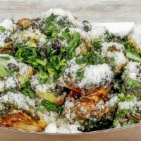 Crispy Brussels · Fried Brussels Sprouts, Creamy Garlic Sauce, Ground Parmesan, Chopped parsley.