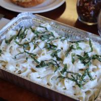 Fettuccine Alfredo With Chicken · Fettuccine baked with Alfredo Sauce topped with fresh basil.